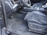 a picture of the inside of a car with the door open