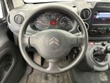 the interior of a car with a steering wheel and dashboard controls