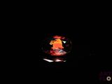 a close up of a red diamond in a black background