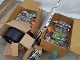 two boxes of assorted items sitting on the ground