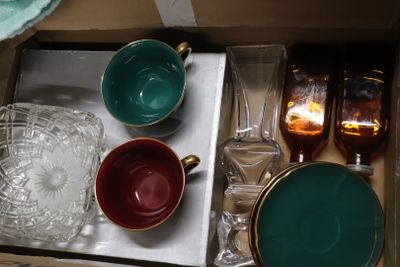 a lot of glassware in a box on the table