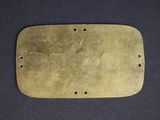 a brass plate with holes and holes on it
