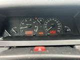 a close up of a car dashboard with a speedometer