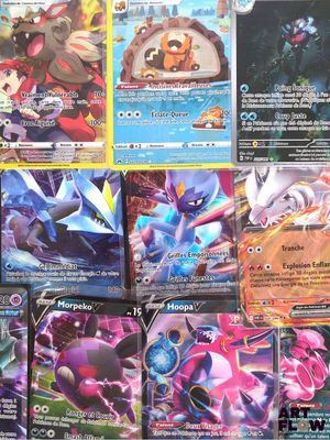 several pokemon cards are displayed on a table in a room