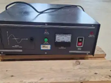 an electronic device sitting on top of a pallet in a warehouse