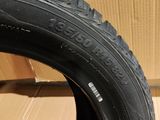 tire of a bicycle on a cardboard box with a cardboard box in the background