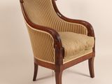 an image of a chair with a striped upholstered back and arms