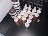 bottles of coffee sit on a counter in a coffee shop
