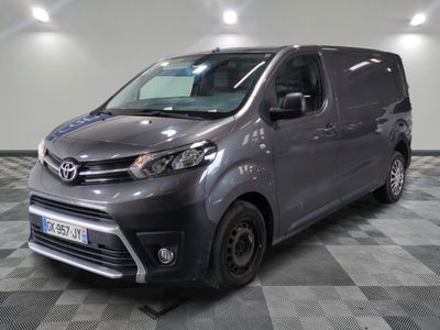 the grey van is parked on a checkered floor in a room