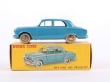 a blue toy car sitting on top of a box