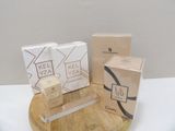 three boxes of kel yaz on a wooden stand next to a box of kel yaz