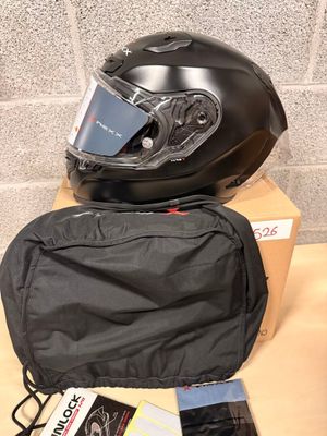 a helmet and a bag sitting on a table