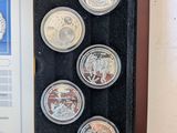 an image of a display case with six coins and a certificate