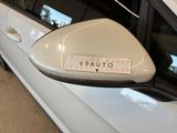 a picture of a side view mirror of a white car