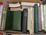 a box full of books sitting on top of a table