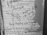 black and white photograph of a framed piece of paper with writing on it