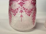 two vases that are sitting on a table