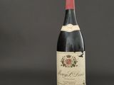 a bottle of wine that is sitting on a table