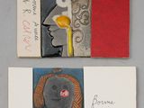 deux livres illustrés et une feuille de papier sur laquelle il y a des mots écrits