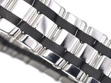 a close up of a watch bracelet on a white surface