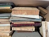 a box full of books sitting on top of a table