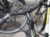 many bicycles parked next to each other in a parking lot