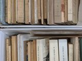 many books on the shelves in the room