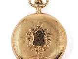 une image d'une montre à gousset en or sur fond blanc