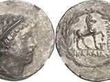 a close up of a coin with an image of a woman on it