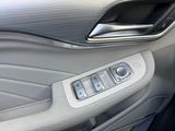 a close up of a car ' s interior with buttons and controls