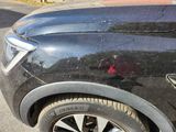a close up of a car ' s tire on the street