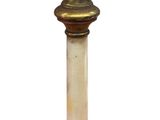 a small wooden pedestal with a marble bowl on top of it