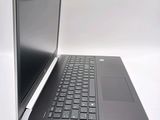 a laptop that is sitting on a white surface