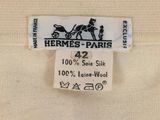 a label on a shirt that says hermes paris