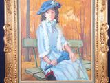 a painting of a woman sitting on a wooden easel