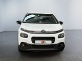 the front of a white citrole parked in a white room