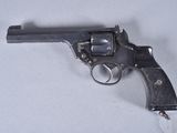 a gun that is on a table with a white background