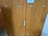 two wooden doors in the middle of a room