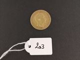 a close up of a coin with a price tag attached to it