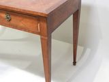 a small wooden table with a drawer on top of it