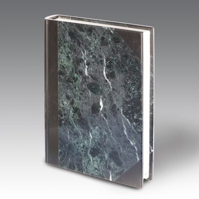 an image of a book with a marble cover on a gray background