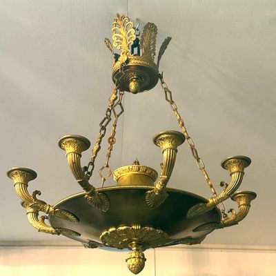 a chandelier hanging from the ceiling in a room