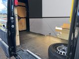 a black van with its doors open and a door open