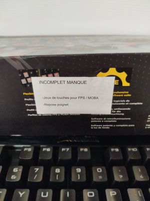a box with a label on it sitting on top of a laptop