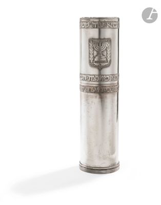 an image of a silver vase with a coat of arms on it