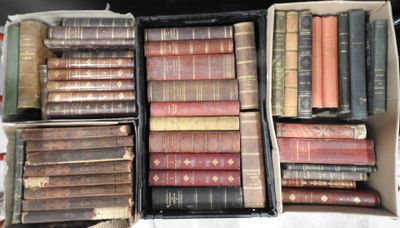 a lot of old books in a box on a table