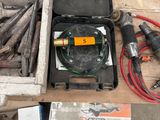 a box of tools on the floor next to a box of wood
