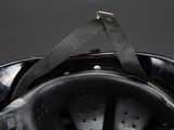 a close up of a helmet with a strap attached to it