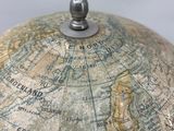 a close up of a globe on a table