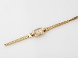 an image of a gold watch on a white background